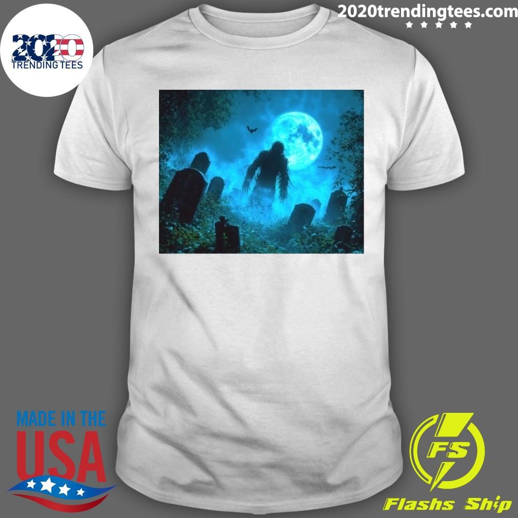 Funny Mysterious Humanoid Creature in Spooky Graveyard with Fog and Bats - Horror and Halloween Vibes T-shirt